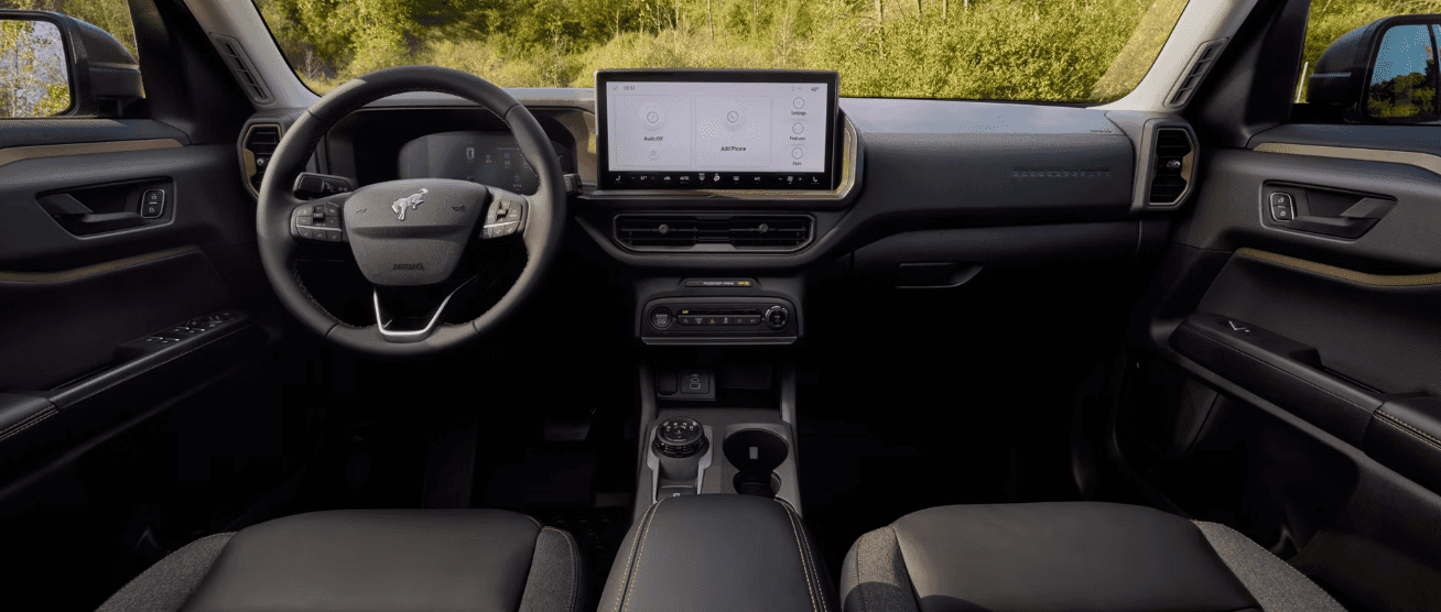 2026 Ford Bronco Sport Badlands interior with SYNC 4 touchscreen and MOLLE seat straps