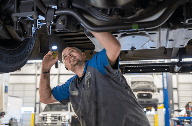 mechanic under car
