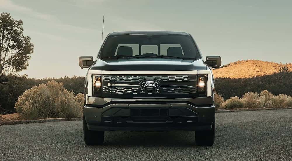 A black 2025 Ford F-150 Lightning for sale near Oakland is parked.
