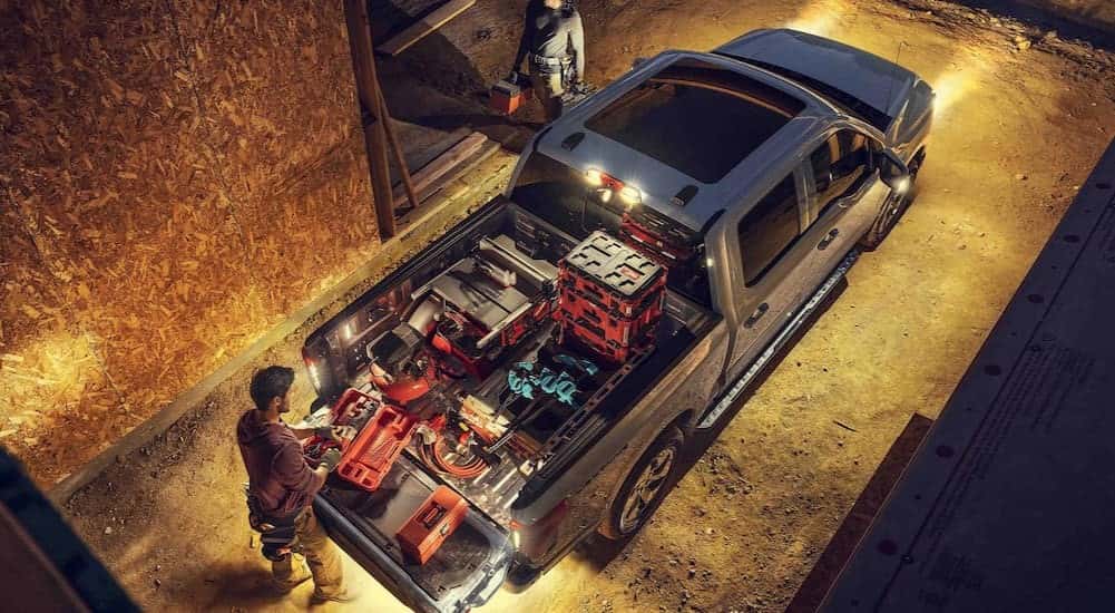 An aerial view of a gray 2025 Ford F-150 Lightning parked on a construction site.