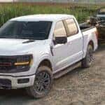 A white 2025 Ford F-150 for sale towing a boat