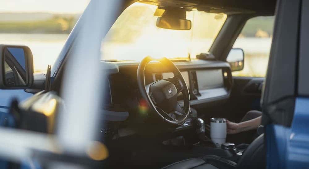 Open door on a blue 2025 Ford Bronco Badlands