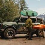 Green 2025 Ford Bronco Badland parked on a hiking road