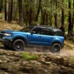 Blue 2026 Ford Bronco Sport Badlands driving on a trail