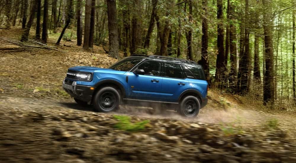 Blue 2026 Ford Bronco Sport Badlands driving on a trail