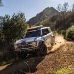 White 2026 Ford Bronco driving to a Ford dealer near Morgan Hill