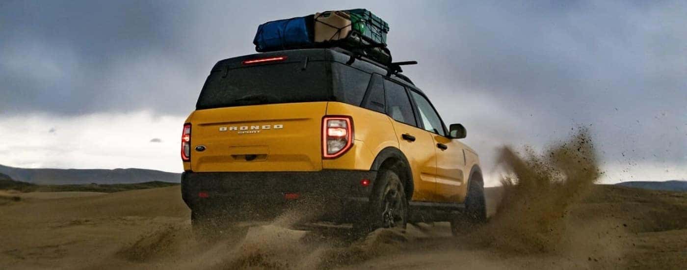 Yellow 2022 Ford Bronco Sport kicking up sand