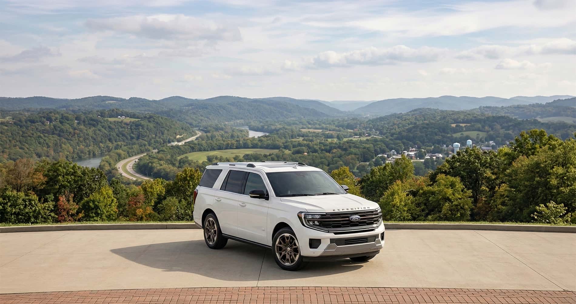 2026 Ford Expedition parked overlooking rolling West Virginia hills and winding highway