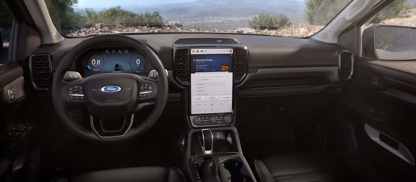 2026 Ford Ranger interior with digital instrument cluster, vertical touchscreen display, and modern dashboard layout