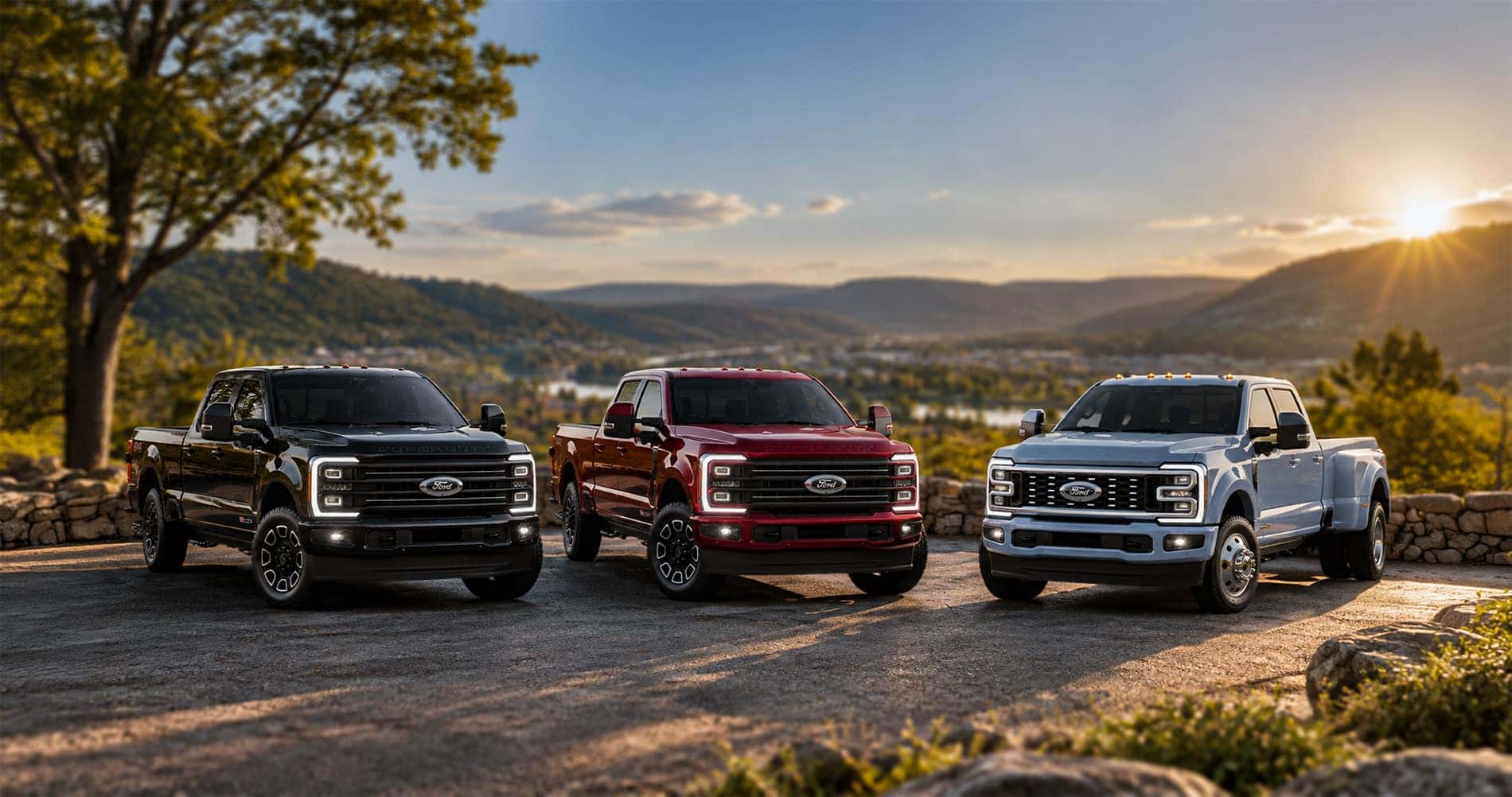 2027 Ford Super Duty truck lineup parked at a scenic overlook in White Hall, WV
