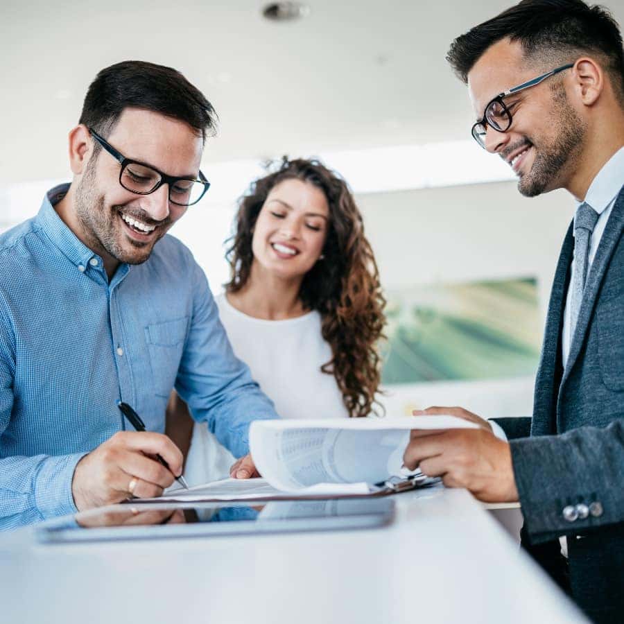 man signing documents