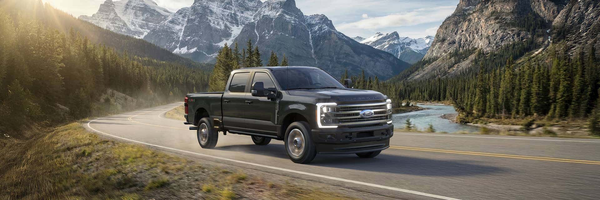 2026 ford f250 driving in front of mountains