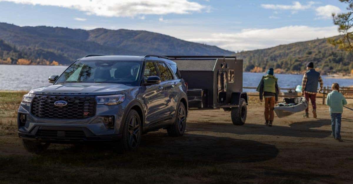 Ford Explorer Pulling a Trailer with a Family