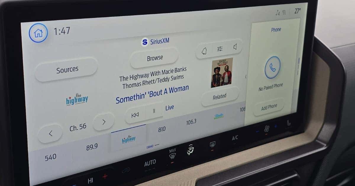 A 2026 Ford Bronco Sport infotainment screen displaying SiriusXM radio with song details for 'Somethin' 'Bout A Woman' by Thomas Rhett and Teddy Swims, alongside phone pairing options and climate control settings.