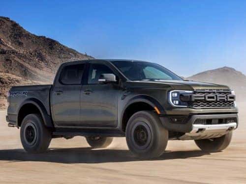 2024  Ford Ranger Raptor driving in a sandy terrain