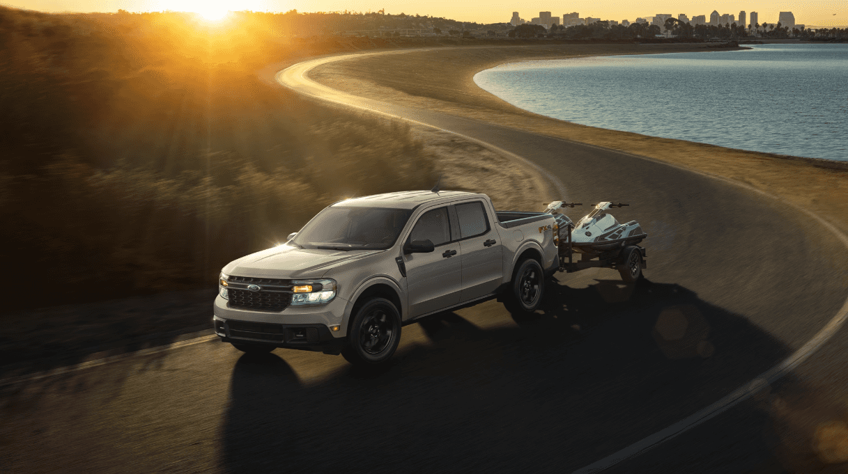 2024 Ford Maverick towing recreational vehicles by a body of water