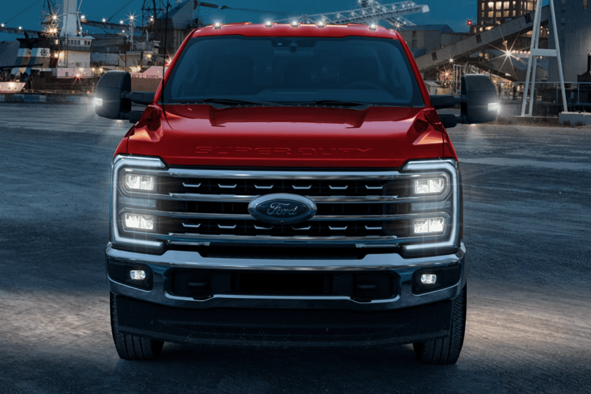 A front view of a red Ford F-450 at a construction site