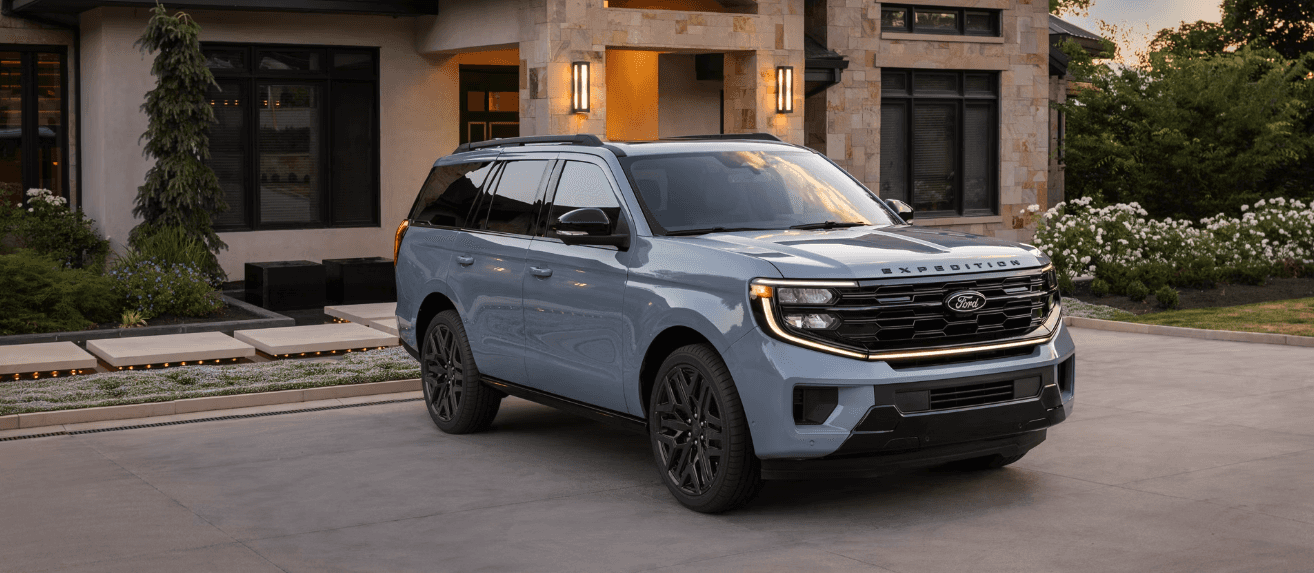2026 Ford Expedition parked in front of a light brown house