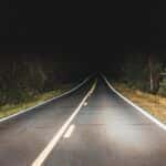 A road with trees on the side