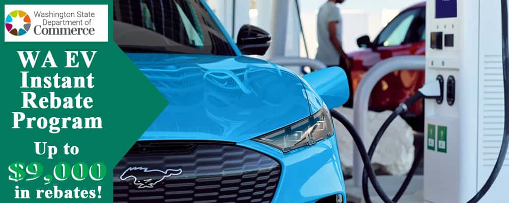 A close up of a car plugged into an electric charger