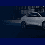 A white car with a blue background