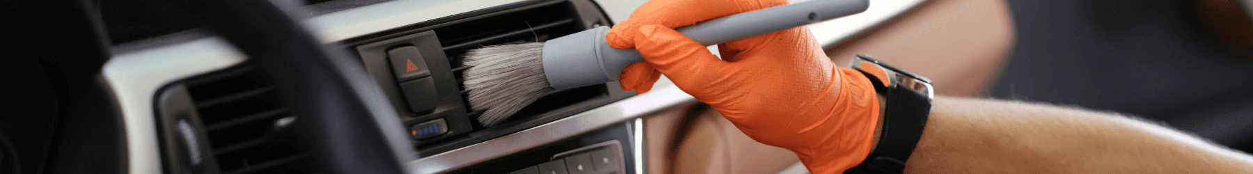 A hand holding a brush