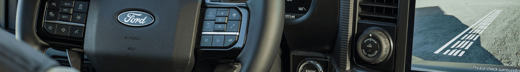 A close up of a steering wheel