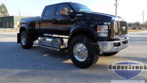 Black Ford truck on pavement