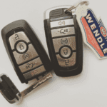 Two Ford key fobs with a Wendle key chain attached.