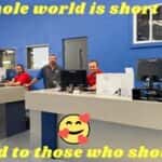 A group of people sitting at a desk