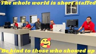 A group of people sitting at a desk