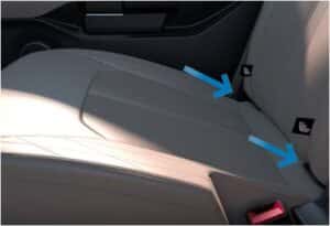 The inside of a car with blue arrows