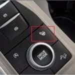 The console on a Ford vehicle showing the Parking Assist button.