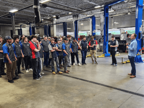 A group of people standing in a room