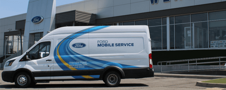 A white van with blue and yellow stripes