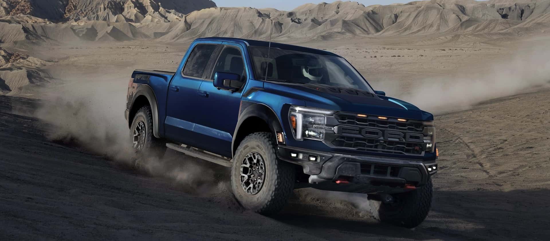 Blue Ford F-150 Driving on a Trail