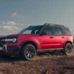 A red Ford Bronco Sport Badlands edition off roading