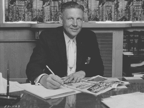 A historical black-and-white photo of founder Chud Wendle at the original dealership.