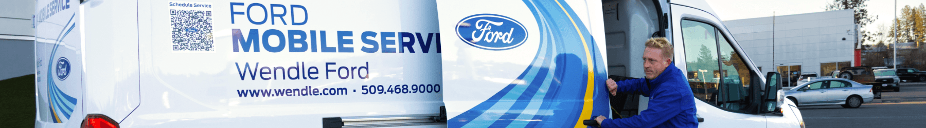 Ford Mobile Service van at Wendle Ford with a technician and a "Schedule Service" QR code.
