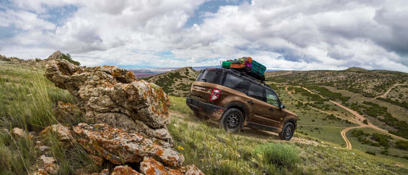 2026 Ford Bronco Exterior Driving Through Grassy Hills