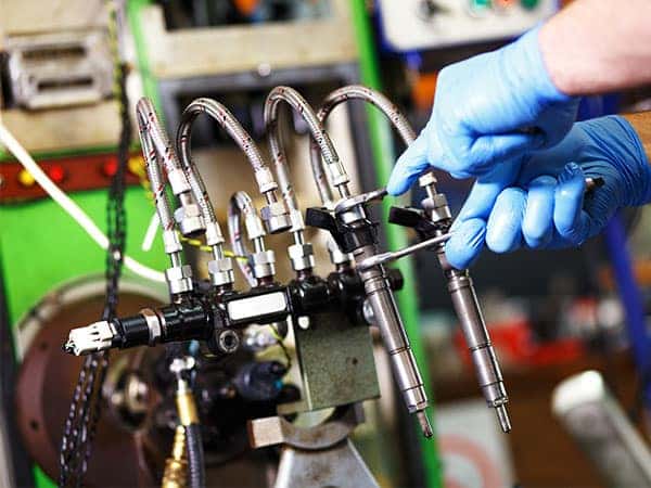 technician testing a diesel injector