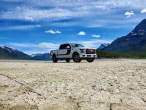 2024 Ford F-150 in white, with a black stripe in the desert