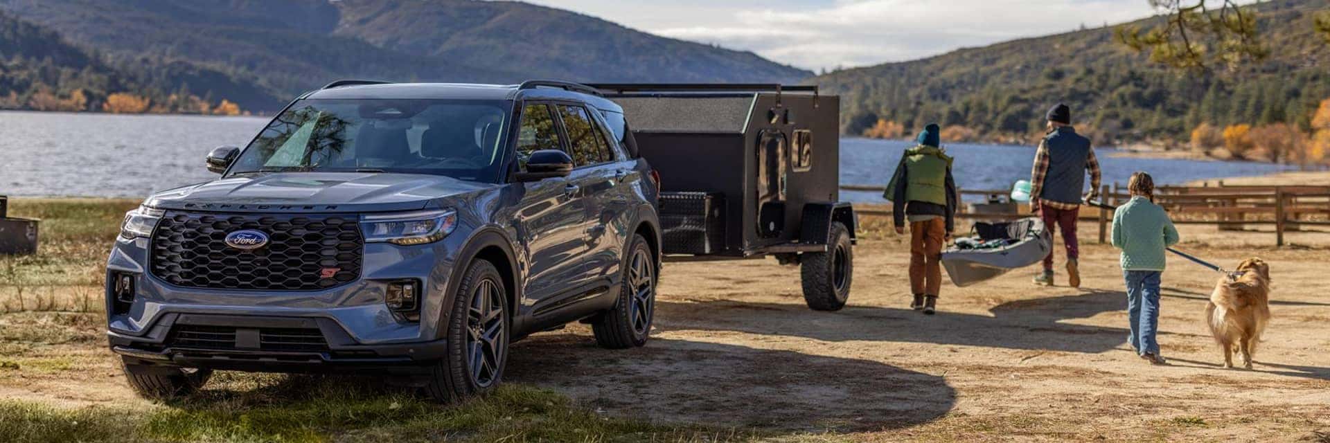 family walking next to 2026 ford explorer