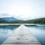 dock leading out onto big lake in the mountains